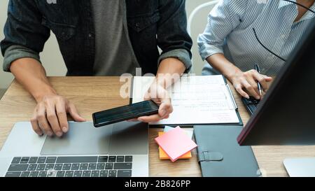 Collaborative work Software engineers website developer technologies or programmer working coding on startup ai application project on screen with par Stock Photo