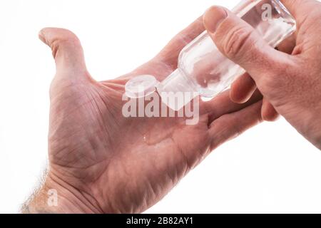 Close up of hand using antibacterial hand sanitizer Stock Photo