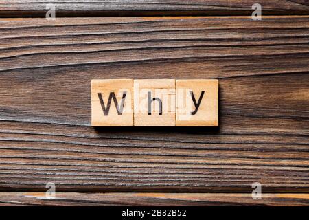 WHY word written on wood block. WHY text on wooden table for your desing, concept. Stock Photo