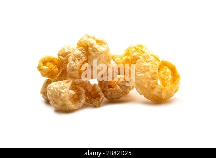 Pork snack crispy and blistered isolated on white background. Crispy pork skin pieces. Food concept. Stock Photo