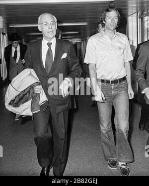 Denis Thatcher with his son Mark arriving at London's Heathrow Airport in January 1982. Stock Photo