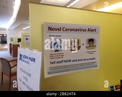 Warning sign with text reading 'Novel Coronavirus Alert', referring to quarantine and screening procedures for patients with possible exposure to a novel coronavirus spreading in China, at a John Muir Health medical center in Walnut Creek, California, February 9, 2020. () Stock Photo