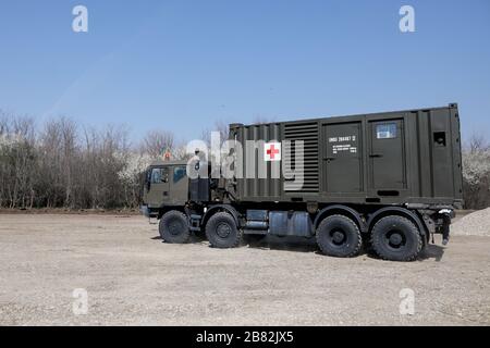 Otopeni, Romania - February 19, 2020: Personnel of the Romanian Army work on the installation of a campaign mobile hospital (ROL 2) to treat Covid-19 Stock Photo