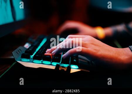 Gaming Keyboard. Professional cyber video gamer studio room with personal computer armchair, keyboard for stream. Stock Photo