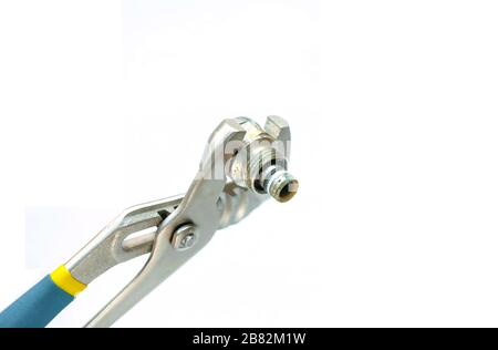Tool for repairing plumbing. The metal key. Insulated device. Stock Photo
