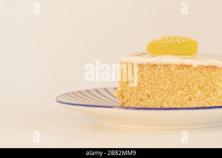 Close Up of a Slice of Lemon Drizzle Cake Stock Photo