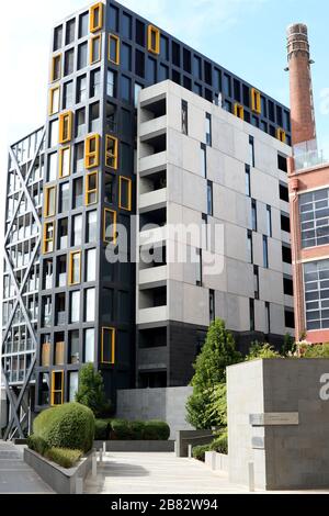 New apartment blocks at Trenerry Crescent, Melbourne. Australia alongside old milliners chimney stack Stock Photo