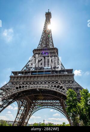Eiffel tower with sun star, Tour Eiffel, Champs de Mars, Paris, Ile-de-France, France Stock Photo