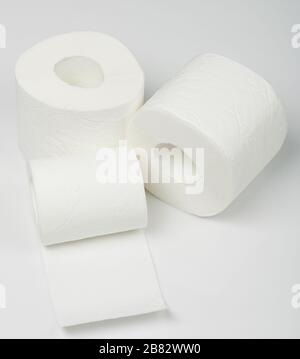 Three rolls of toilet paper isolated on white studio background Stock Photo