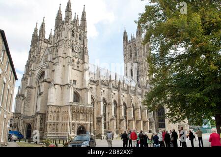 People, tourists, in the grounds of Canterbury Cathedral, Canterbury, Kent, England Stock Photo