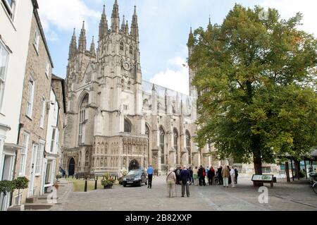 People, tourists, in the grounds of Canterbury Cathedral, Canterbury, Kent, England Stock Photo