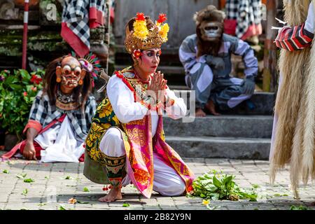 A Female Performer Dancing During A Traditional Balinese Barong and Kris Dance Show, Batabulan, Bali, Indonesia. Stock Photo