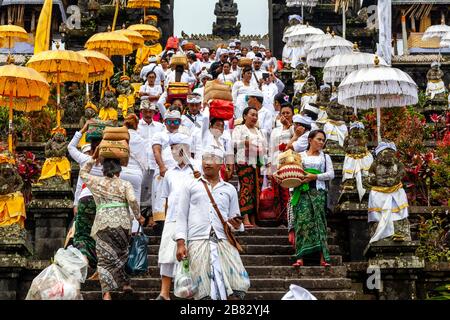 Balinese Hindu People At The Batara Turun Kabeh Ceremony, Besakih Temple, Bali, Indonesia. Stock Photo