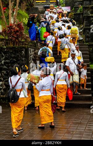 Balinese Hindu People At The Batara Turun Kabeh Ceremony, Besakih Temple, Bali, Indonesia. Stock Photo