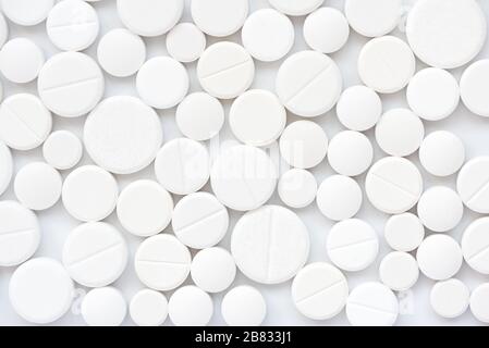 White medical tablets abstract background. Top view. Flu, illness, pandemic concept Stock Photo