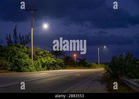 Lonely rural road at night Stock Photo