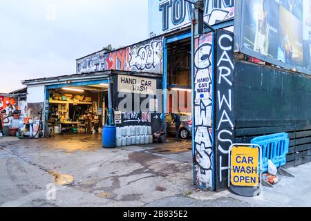 Hand car-wash with graffiti in Kentish Town, London, UK Stock Photo