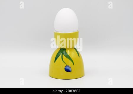 Yellow Egg Cup on White Stock Photo
