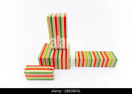 Shopping in colorful packaging. Boxes with xmas presents wrapped. Isolated on white background Stock Photo