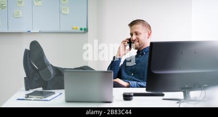 Concentrated Businessman Working On Computer In Office Stock Photo