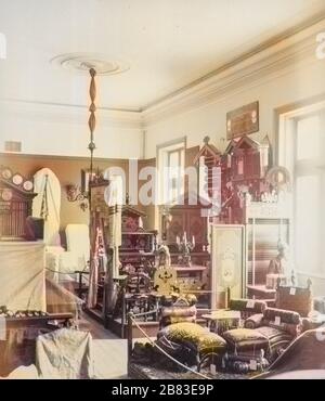 Photograph of a stand at the exhibition with furniture of the 19th century from Romanov palace, Saint Petersburg, Russia, 1885. Note: Image has been digitally colorized using a modern process. Colors may not be period-accurate. () Stock Photo