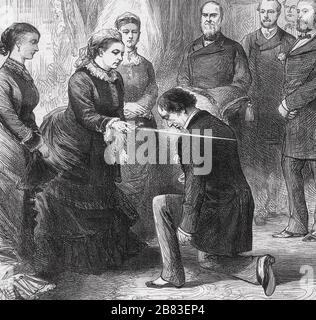 BENJAMIN DISRAELI (1804-1881) British Conservative politician being receiving the Order of the Garter from Queen Victoria at Osborne in July 1878 Stock Photo