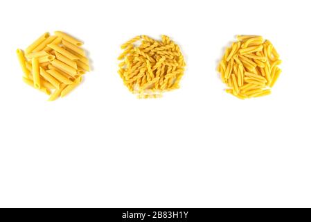 Various kind of raw Italian pasta isolated on white background. Food and drink concept , uncooked pasta on white background. Top view. Copy Space Stock Photo