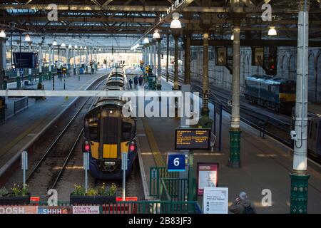 Edinburgh, UK. 19th Mar, 2020. Pictured: Delayed service due to a person being struck by a train between Dunbar and Prestonpans. Waverley Station during rush hour during the Coronavirus Pandemic. What would normally be hustle and bustle packed with commuters trying to get home, a more or less empty concourse. Credit: Colin Fisher/Alamy Live News Stock Photo