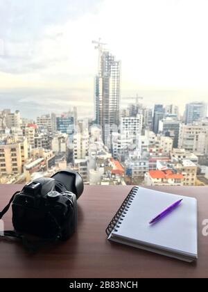 Ready to capture the beautiful view of the city with camera, pen and paper Stock Photo