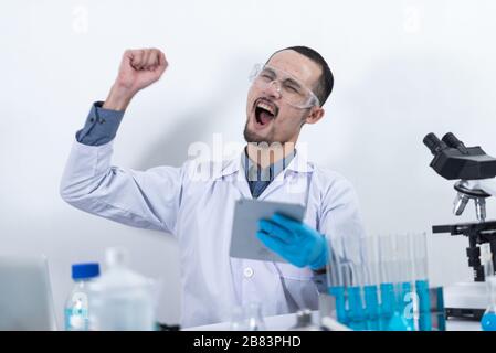 Scientists are working with digital tablet in laboratory Stock Photo