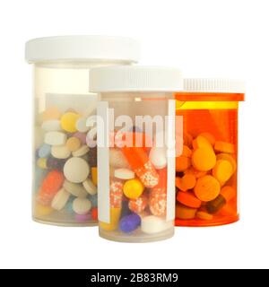 Group of three medicine bottles filled with various pills isolated on white Stock Photo