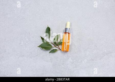 Natural face serum, botulin and Hyaluronic acid at stone table. Stock Photo