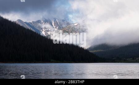 The Never Summer Range is south of Long Draw Reservoir. This is a view from the shore line on Long Draw Reservoir in Northern Colorado. Stock Photo