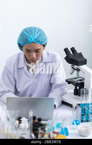 using laptop for working in laboratory Stock Photo