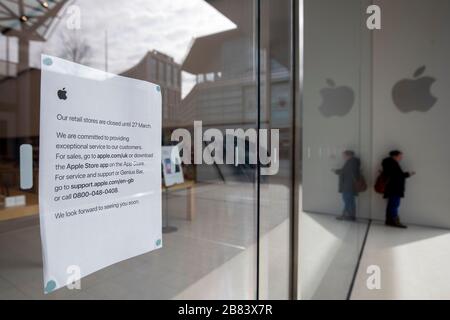 Coronavirus related signs in shop windows as retailers around the United Kingdom close down Stock Photo