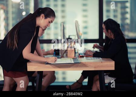 A group of young businessmen are discussing happily. For creative work Stock Photo