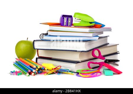 Stack of books and school supplies isolated on a white background Stock Photo