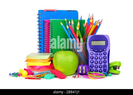 Books and a colorful group of school supplies isolated on a white background Stock Photo