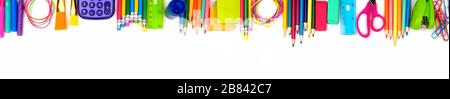 School supplies long top border. Top view isolated on a white background. Back to school concept. Stock Photo