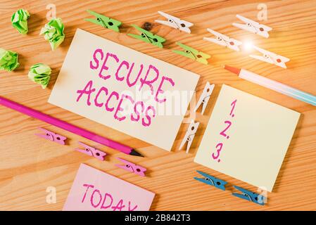 Writing note showing Secure Access. Business concept for enhance the security and cryptography performance in devices Colored clothespin papers empty Stock Photo