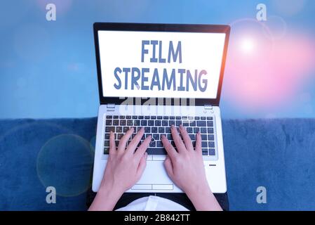 Handwriting text Film Streaming. Conceptual photo act of watching sound or video directly from the internet Stock Photo
