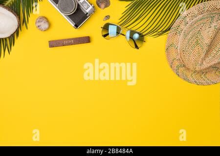 Summer composition with beach accessories, on yellow background. Top view, copy space. Flat lay. Stock Photo