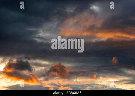 A dramatic sunset sky in the Andes mountain range showing light and dark, Quito, Ecuador. Stock Photo