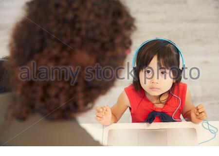 Two little girls using childrens toilets Stock Photo - Alamy