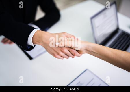 Cropped Image Of Business People Shaking Hands Stock Photo