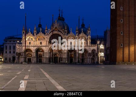 Empty St Marks Square and illuminated Basilica in the early Morning, Venice/Italy Stock Photo