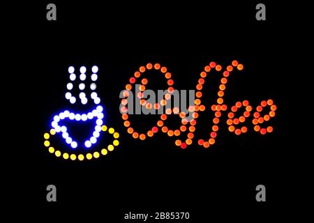 Coffee shop sign LED Bokeh light on dark background, Coffee shop sign Light signage bokeh dot colorful, Sign word coffee cup neon dot light symbol on Stock Photo