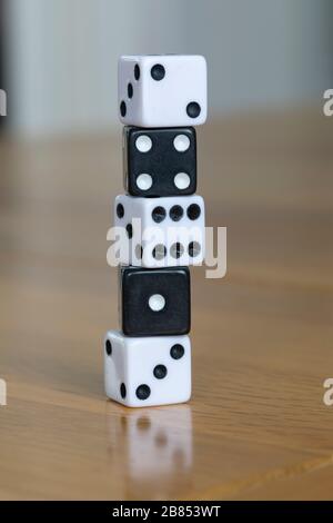 A small column of black and white dice. Stock Photo
