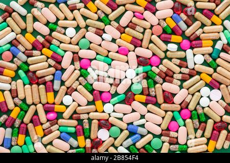 Medicine pills, tablets and capsules background, texture. Colorful variation of pharmacy products, top view. Medical treatment, health concept Stock Photo
