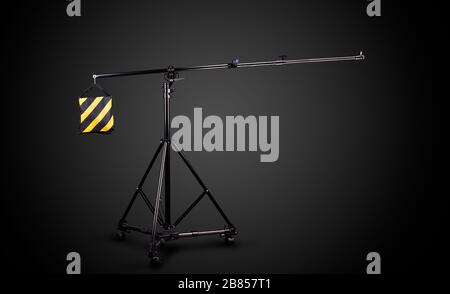 Photo studio lighting stands isolated on the black background. Stock Photo